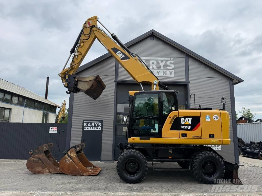 CAT M316F Gumikerekes kotrók