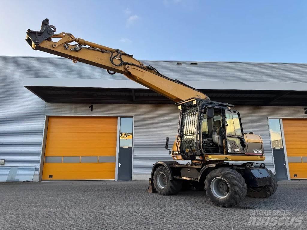 CAT M315C Gumikerekes kotrók