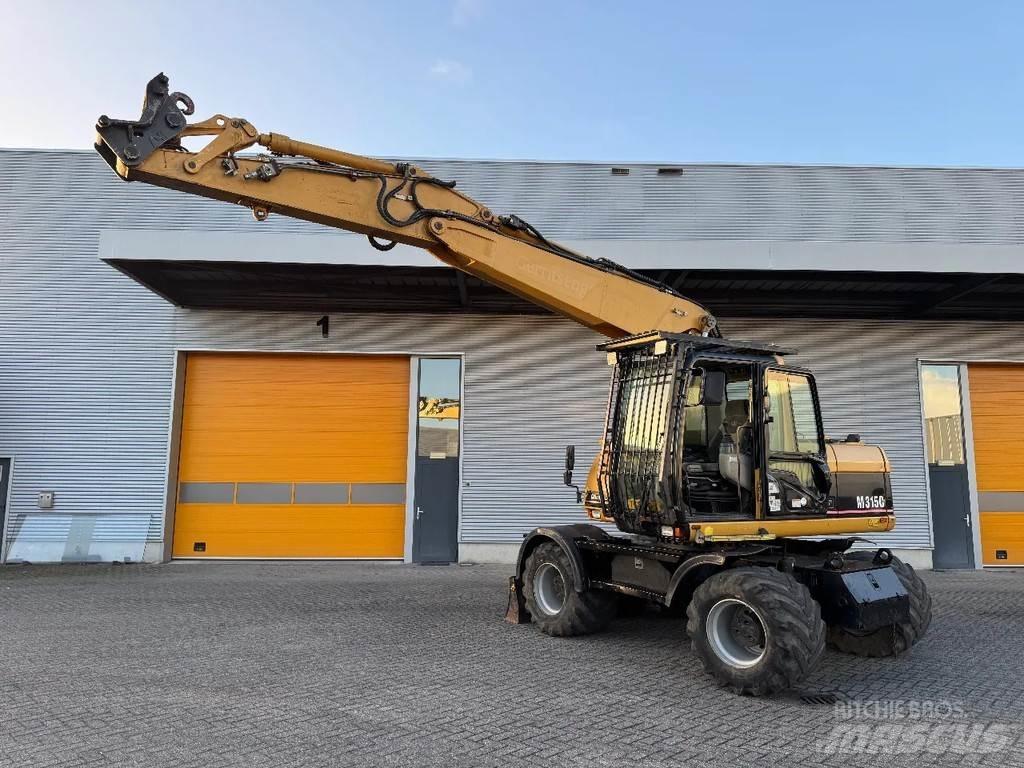 CAT M315C Gumikerekes kotrók