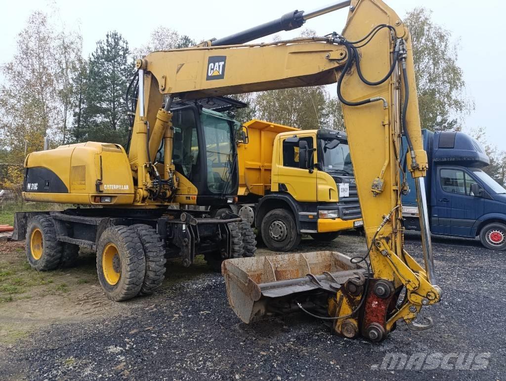 CAT M 318 C Gumikerekes kotrók