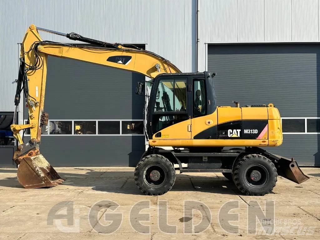 CAT M313D Gumikerekes kotrók