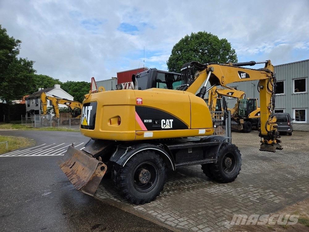 CAT M313D Gumikerekes kotrók