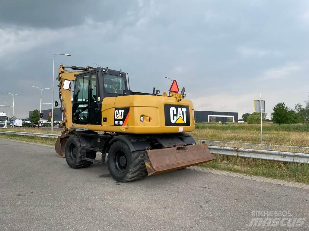 CAT M313D - CE Gumikerekes kotrók