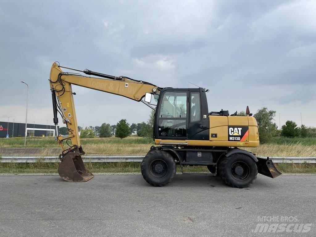 CAT M313D - CE Gumikerekes kotrók