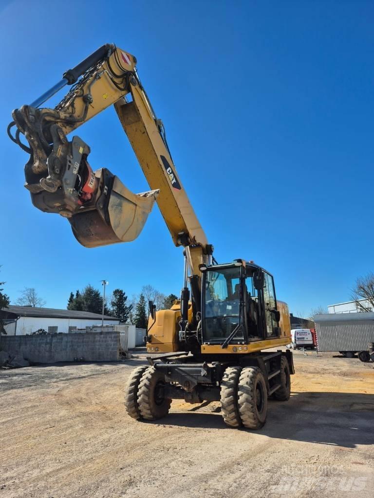 CAT M322F Gumikerekes kotrók