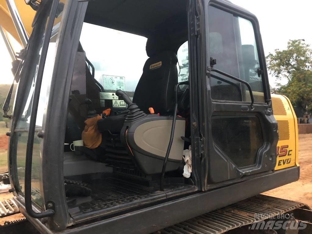 New Holland E 145 Lánctalpas kotrók
