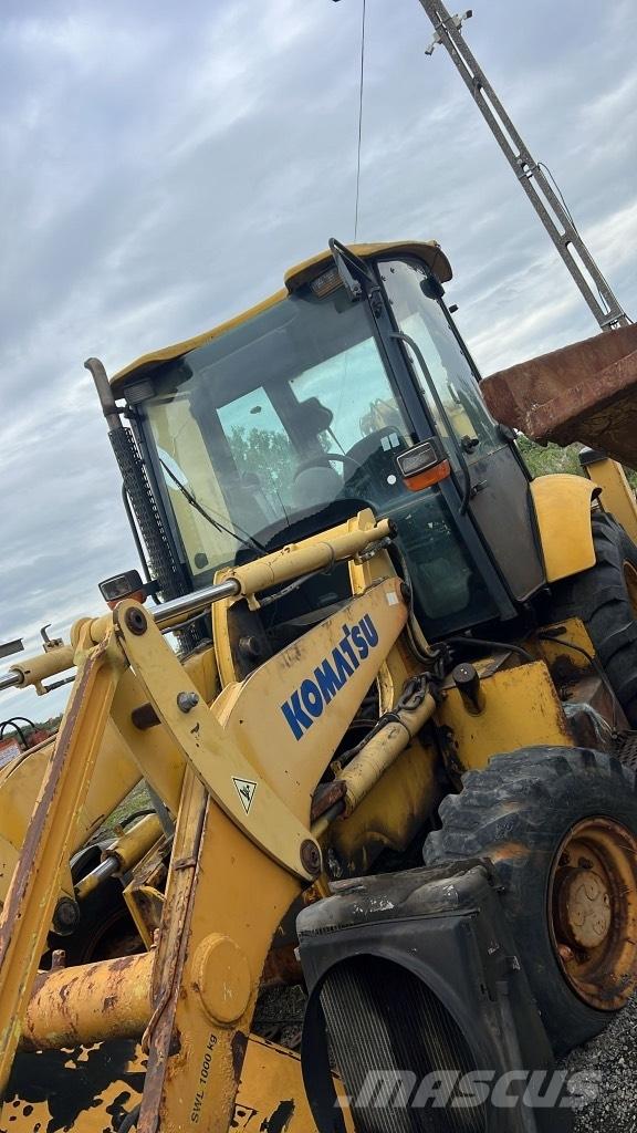 Komatsu WB 93 R Lánctalpak, láncok és futóművek