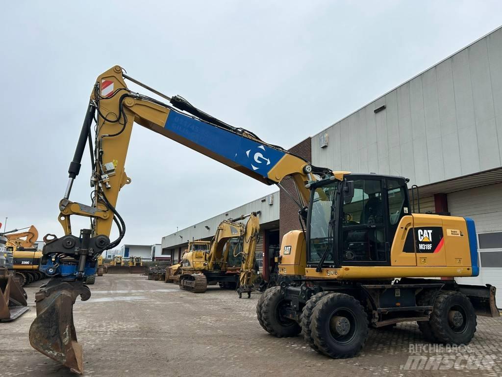 CAT M 318 F Gumikerekes kotrók