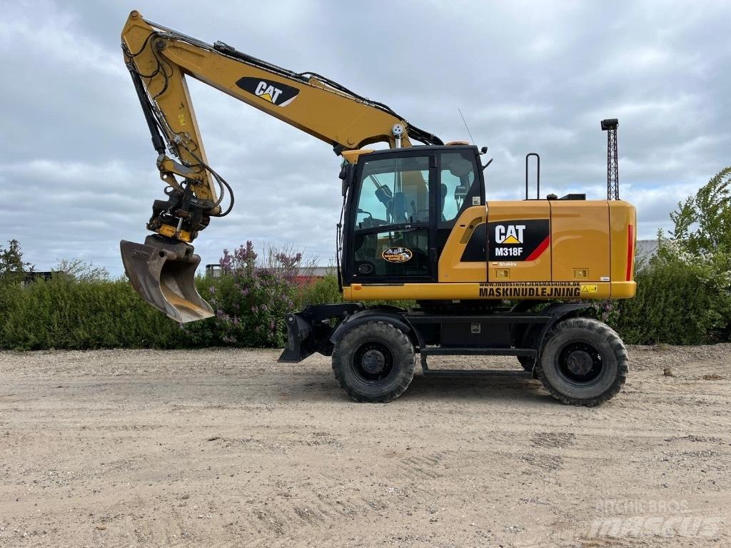 CAT M 318 F Gumikerekes kotrók