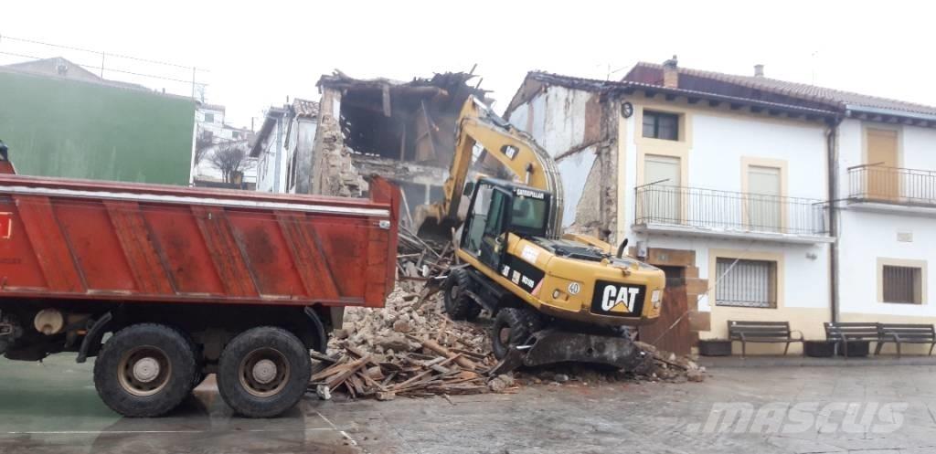 CAT M318d Gumikerekes kotrók