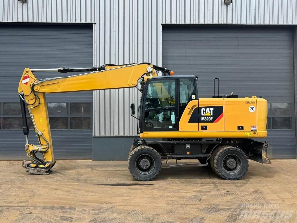 CAT M320F Gumikerekes kotrók