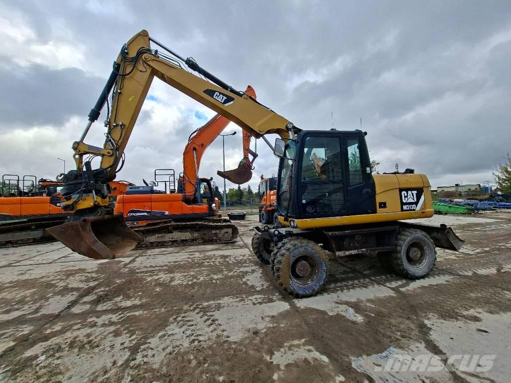 CAT M313D Gumikerekes kotrók
