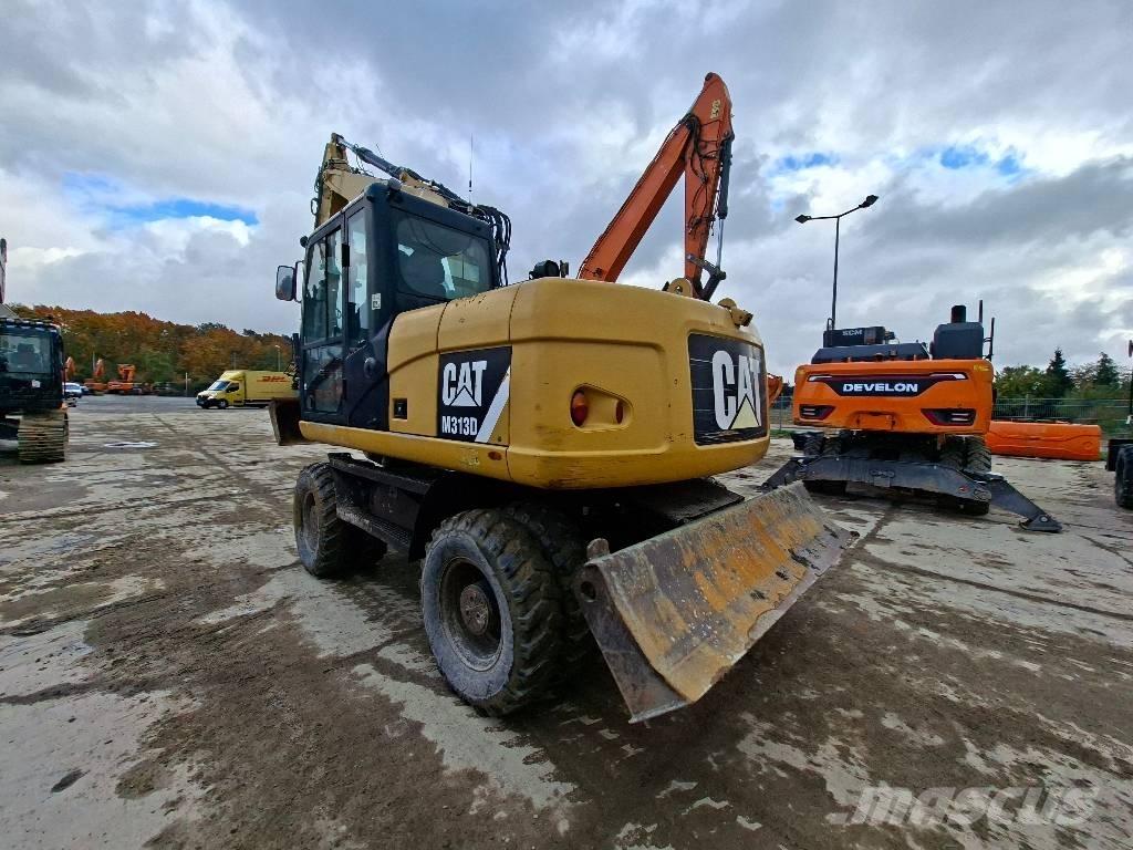 CAT M313D Gumikerekes kotrók