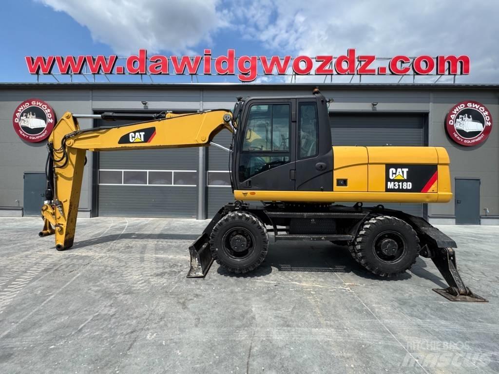 CAT M 318 D Gumikerekes kotrók
