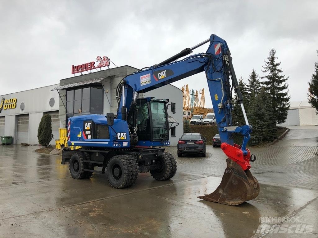 CAT M318F Gumikerekes kotrók