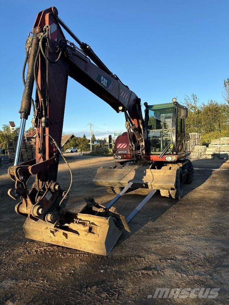 CAT 313 D Gumikerekes kotrók