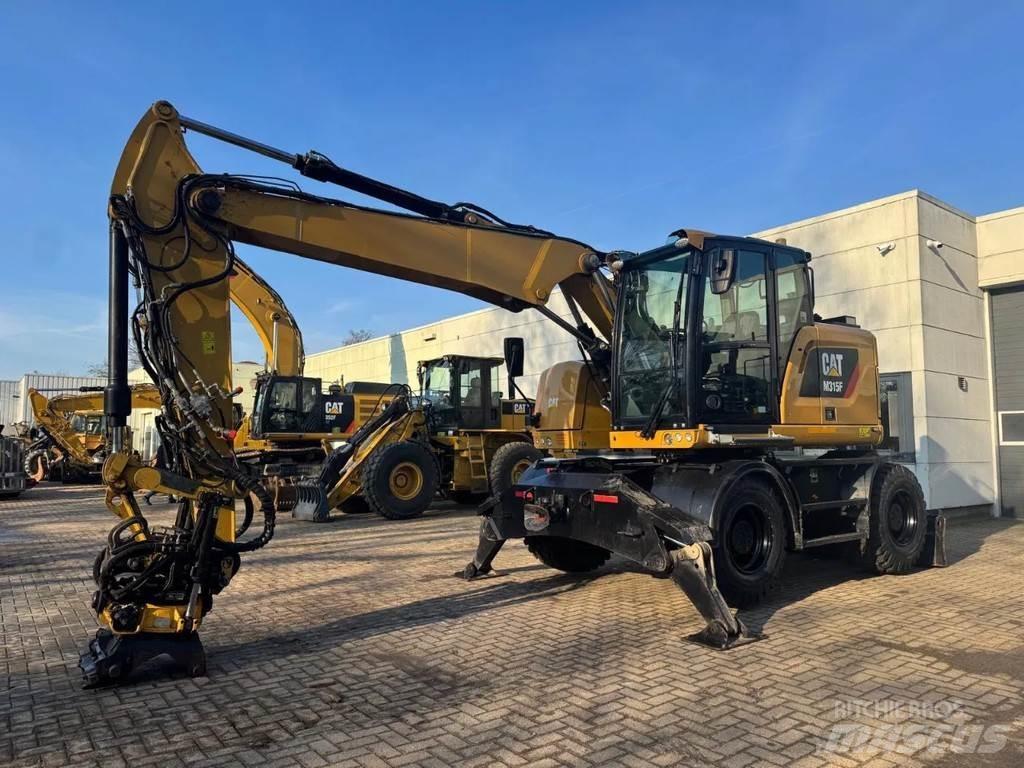 CAT M315F Gumikerekes kotrók