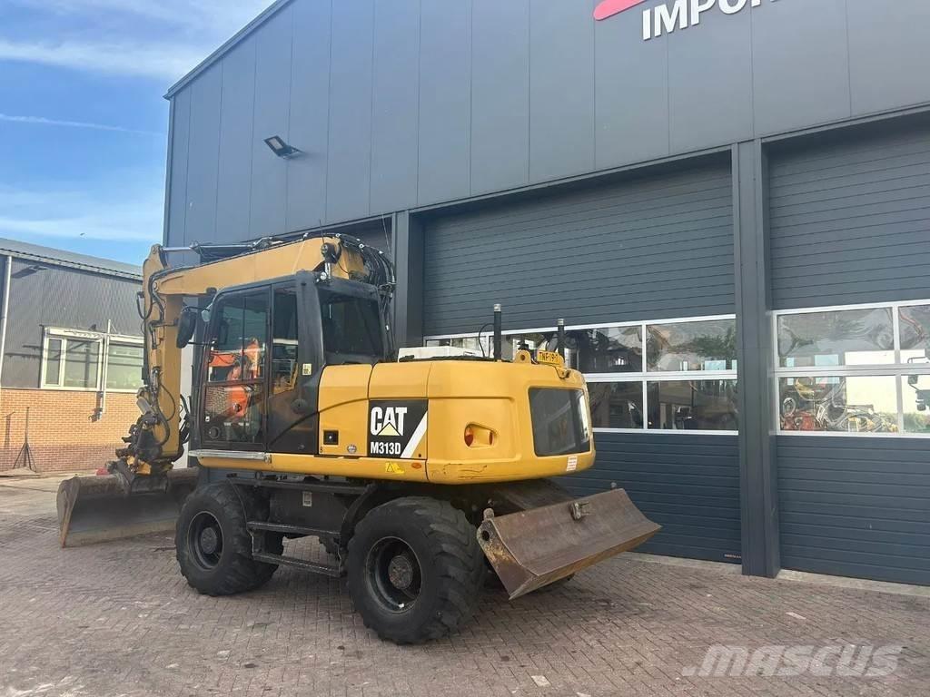 CAT M313D Gumikerekes kotrók