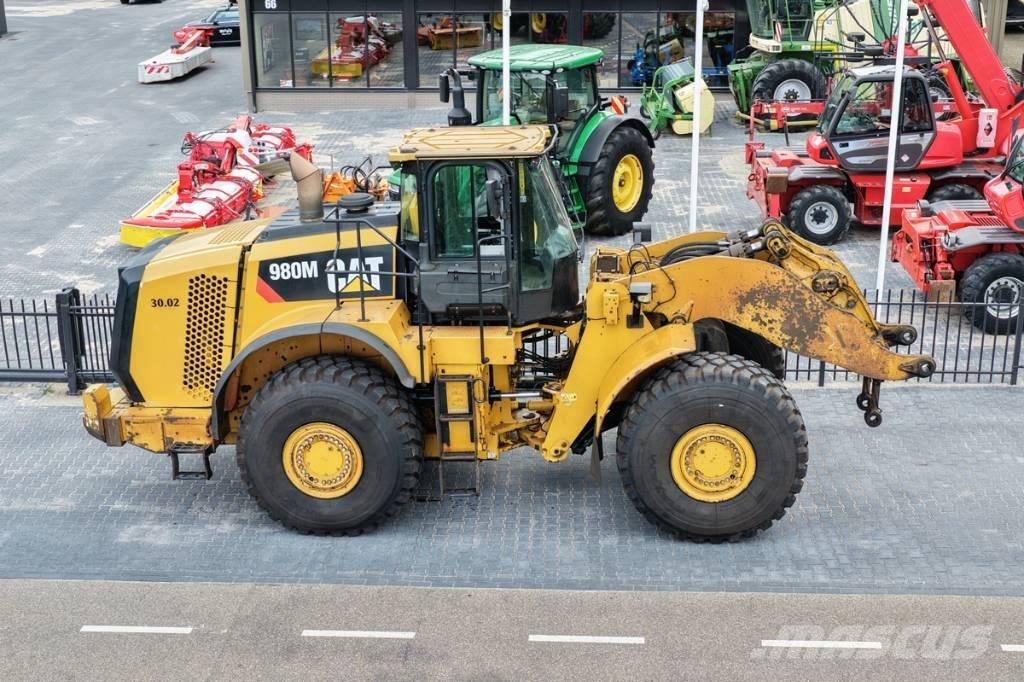 CAT 980M shovel + Bak Gumikerekes homlokrakodók