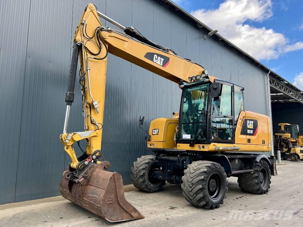 CAT M318F Gumikerekes kotrók
