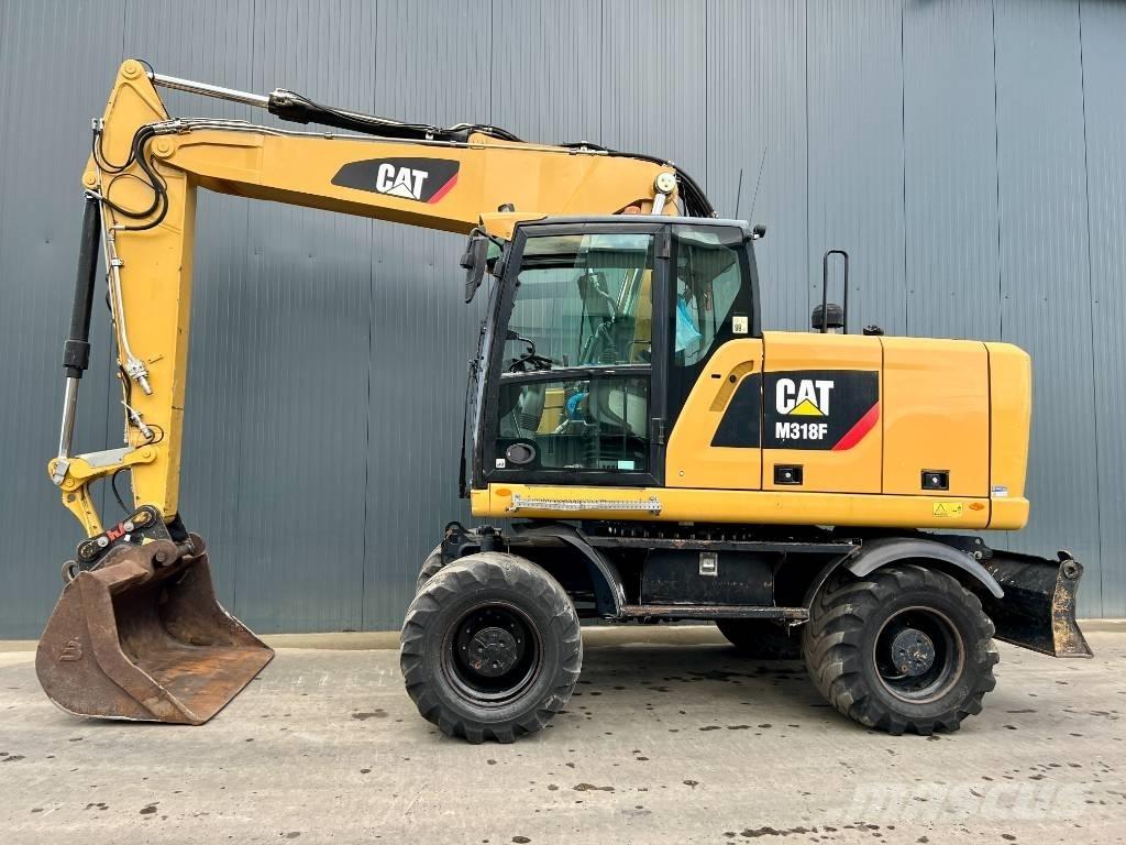 CAT M318F Gumikerekes kotrók