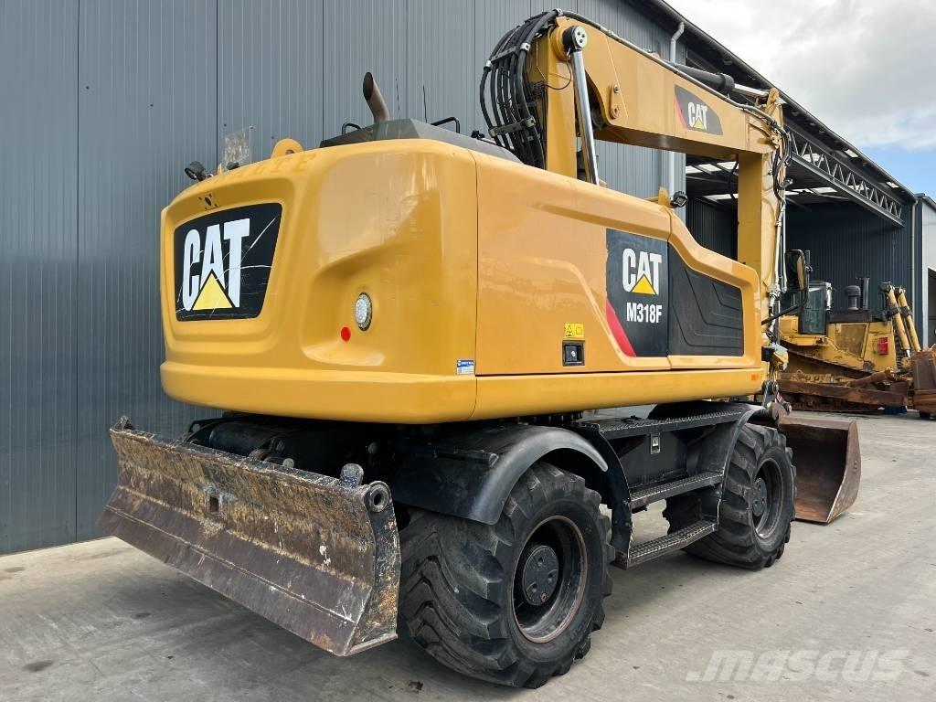 CAT M318F Gumikerekes kotrók