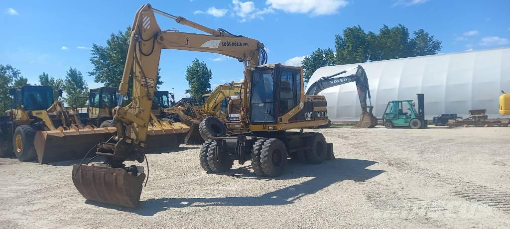 CAT M 315 Gumikerekes kotrók