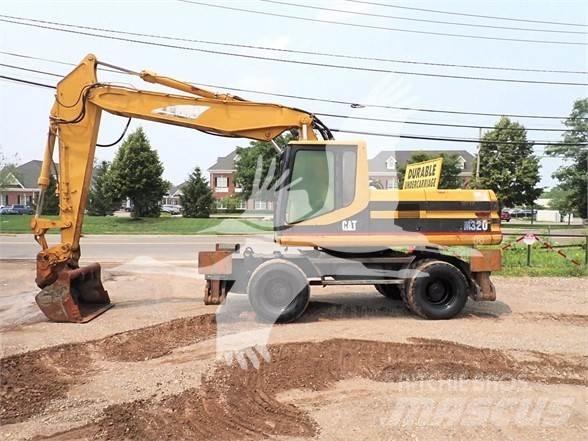CAT M320 Gumikerekes kotrók