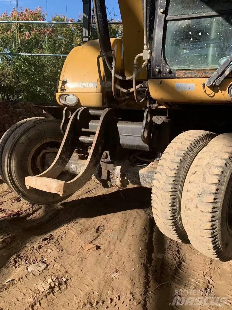 CAT 315 D Gumikerekes kotrók