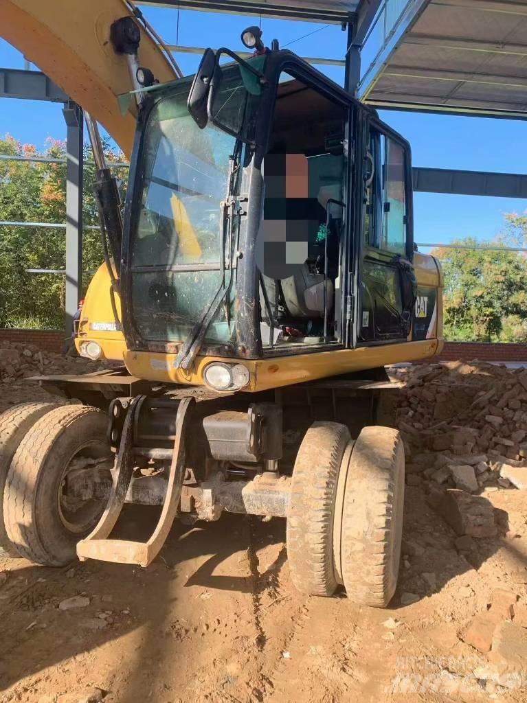 CAT 315 D Gumikerekes kotrók