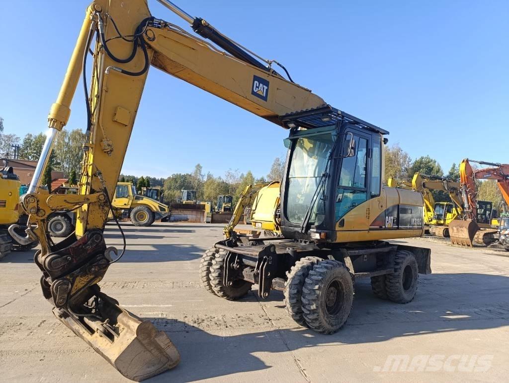 CAT M 318 C Gumikerekes kotrók