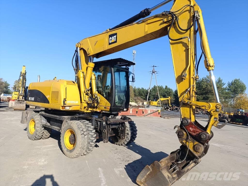 CAT M 318 C Gumikerekes kotrók