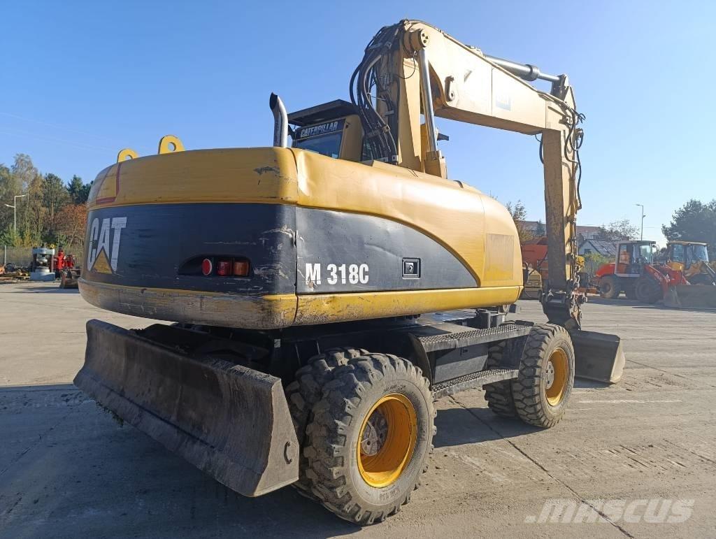 CAT M 318 C Gumikerekes kotrók