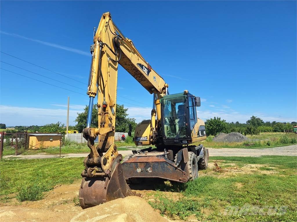 CAT M 318 C 4X4 Építőipar - Egyebek