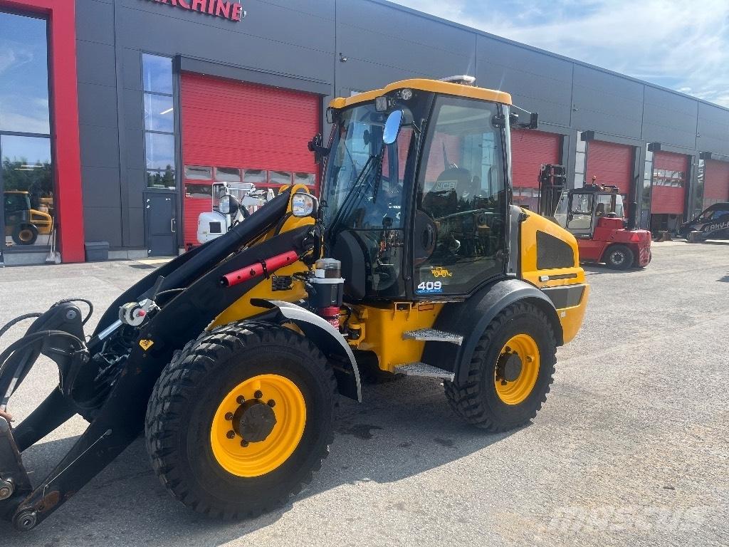 JCB 409 / Myyty, Sold Gumikerekes homlokrakodók