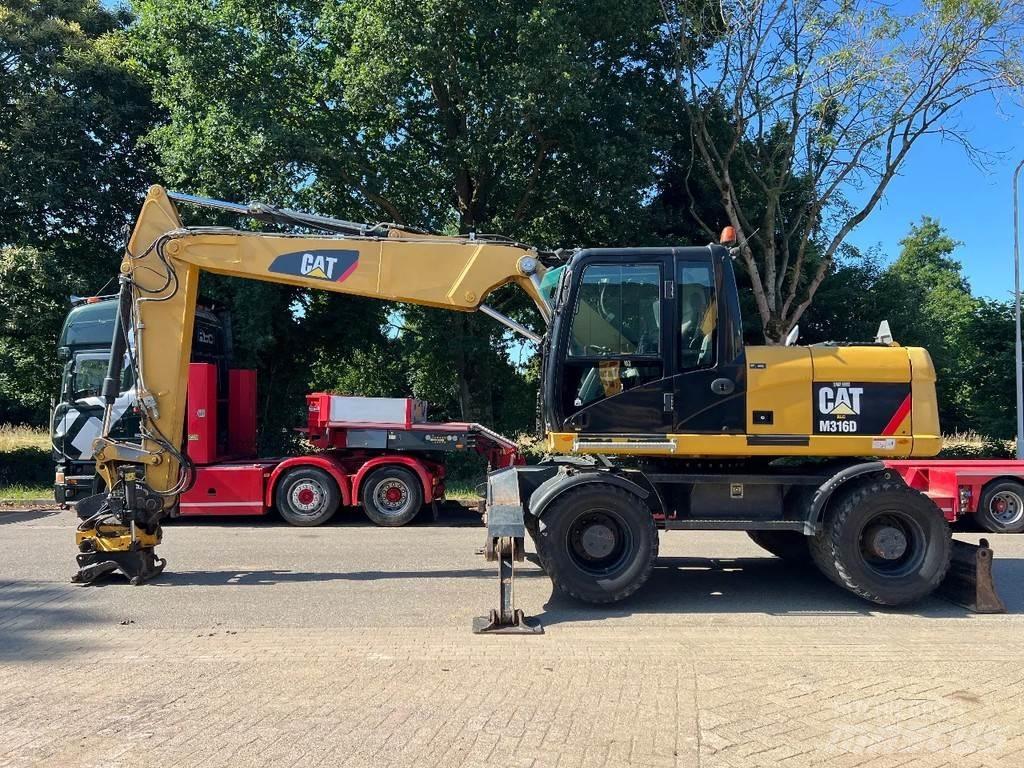 CAT M316D Gumikerekes kotrók
