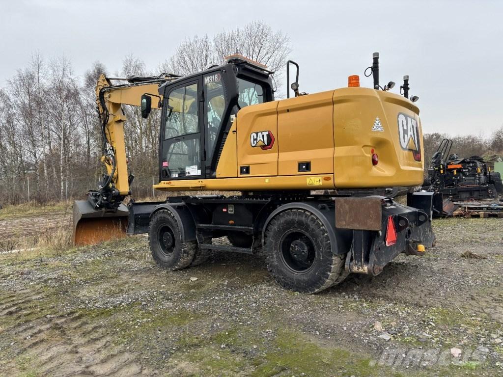CAT M 318 Gumikerekes kotrók