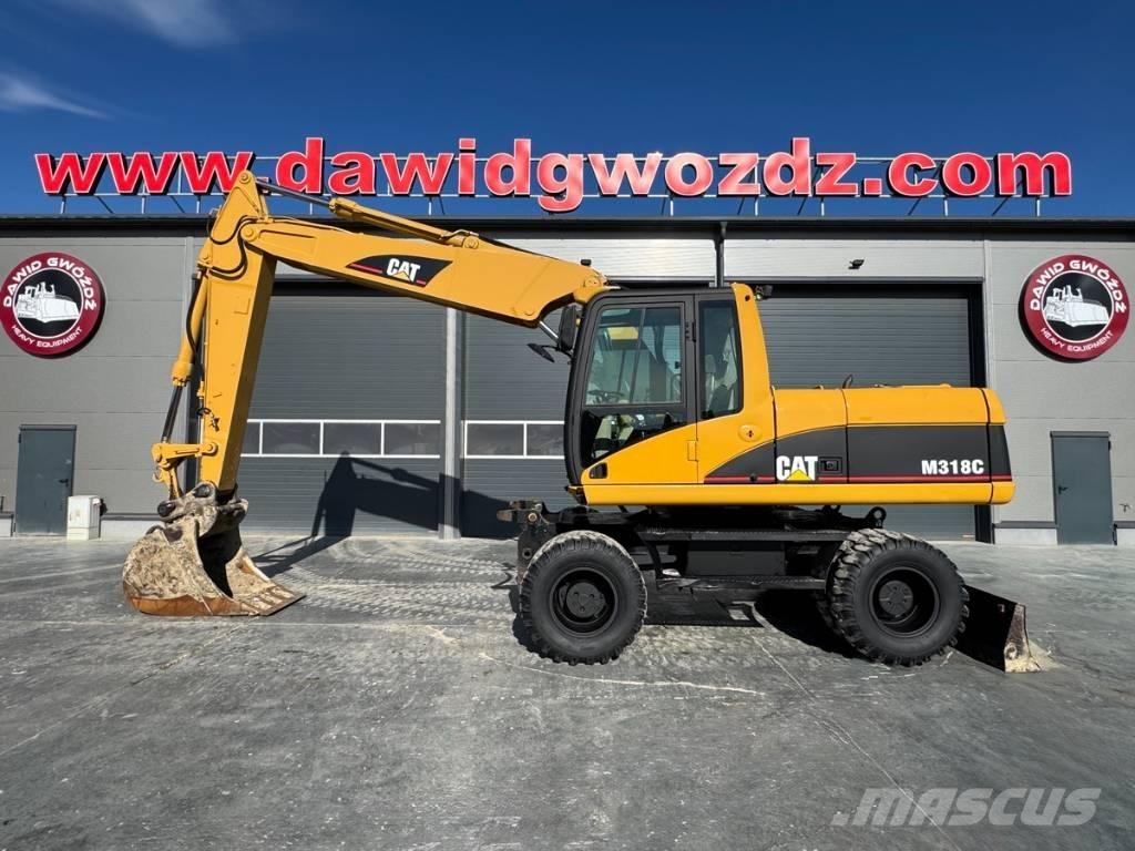 CAT M 318 C Gumikerekes kotrók