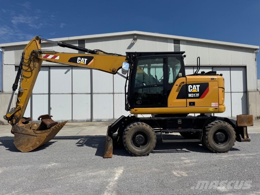 CAT M317F Gumikerekes kotrók