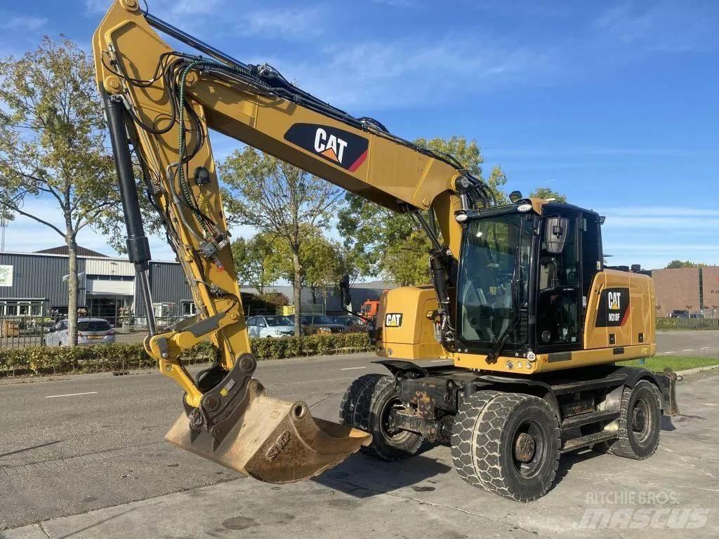 CAT M318F Gumikerekes kotrók