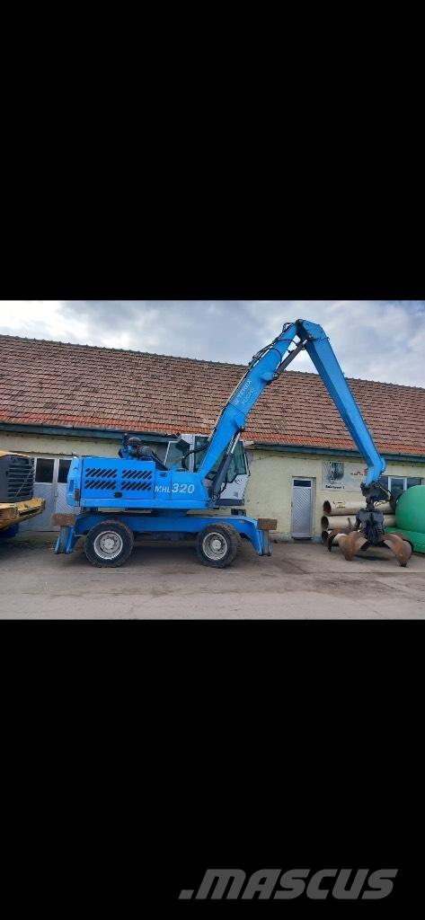Fuchs MHL 320 Gumikerekes kotrók