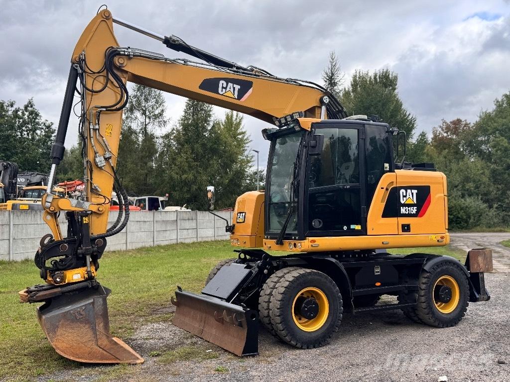 CAT M315F Gumikerekes kotrók