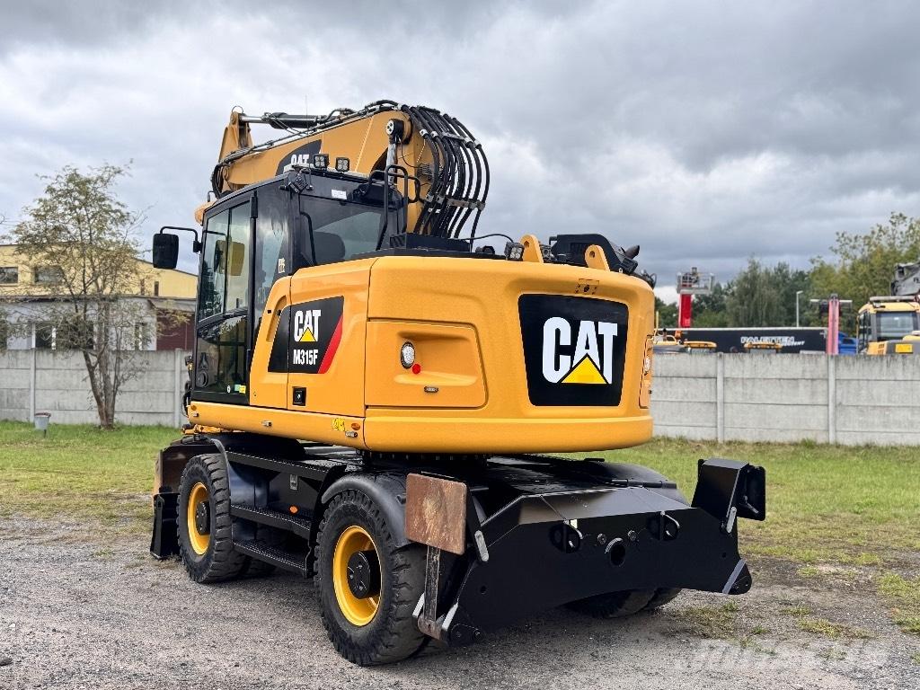CAT M315F Gumikerekes kotrók