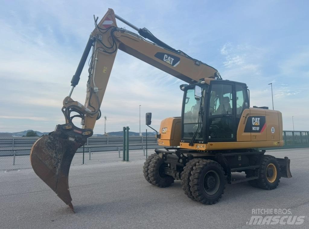 CAT M 318 F Gumikerekes kotrók