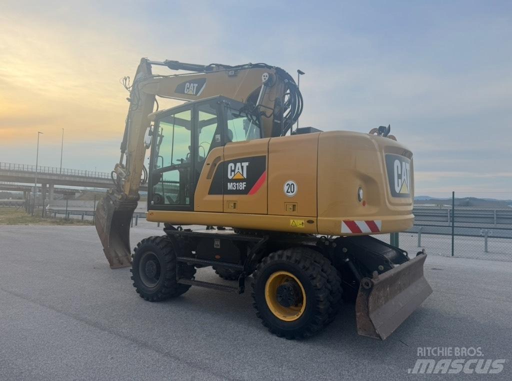 CAT M 318 F Gumikerekes kotrók