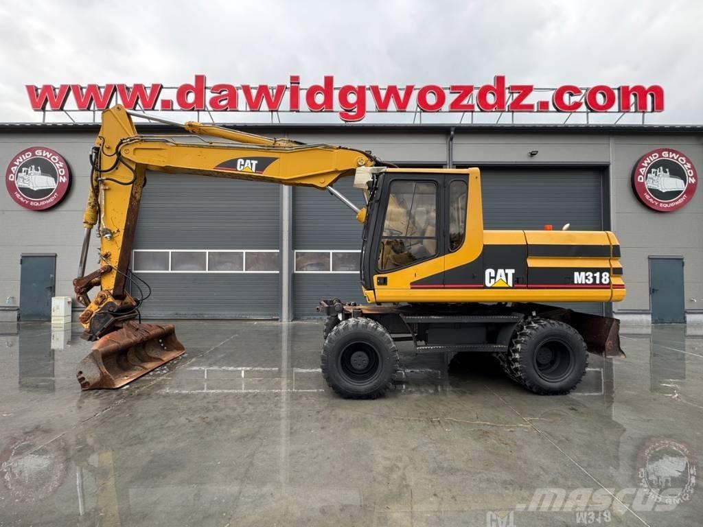 CAT M 318 Gumikerekes kotrók