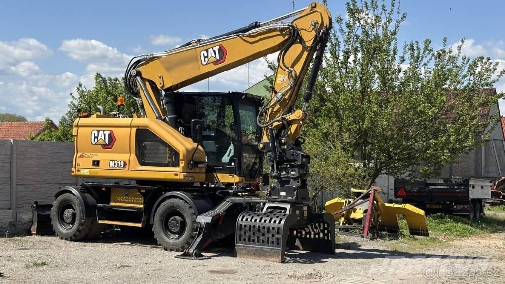 CAT M 319 Gumikerekes kotrók