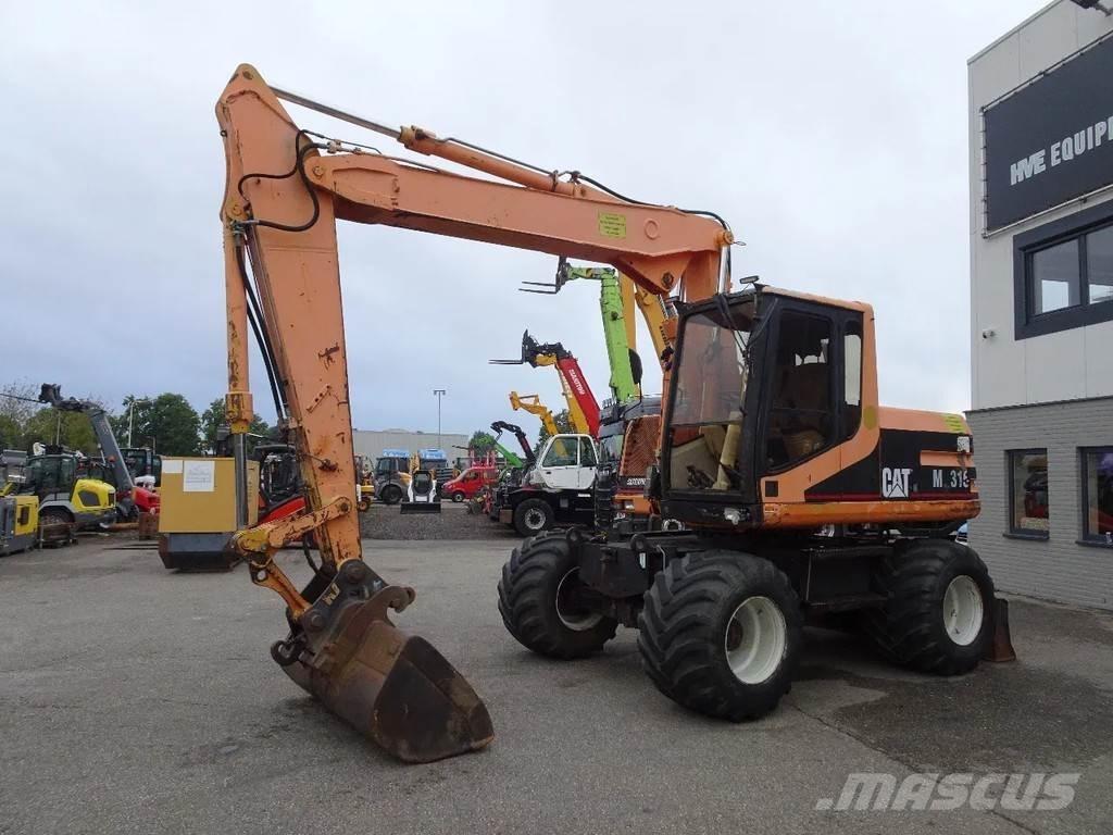 CAT M315 Gumikerekes kotrók