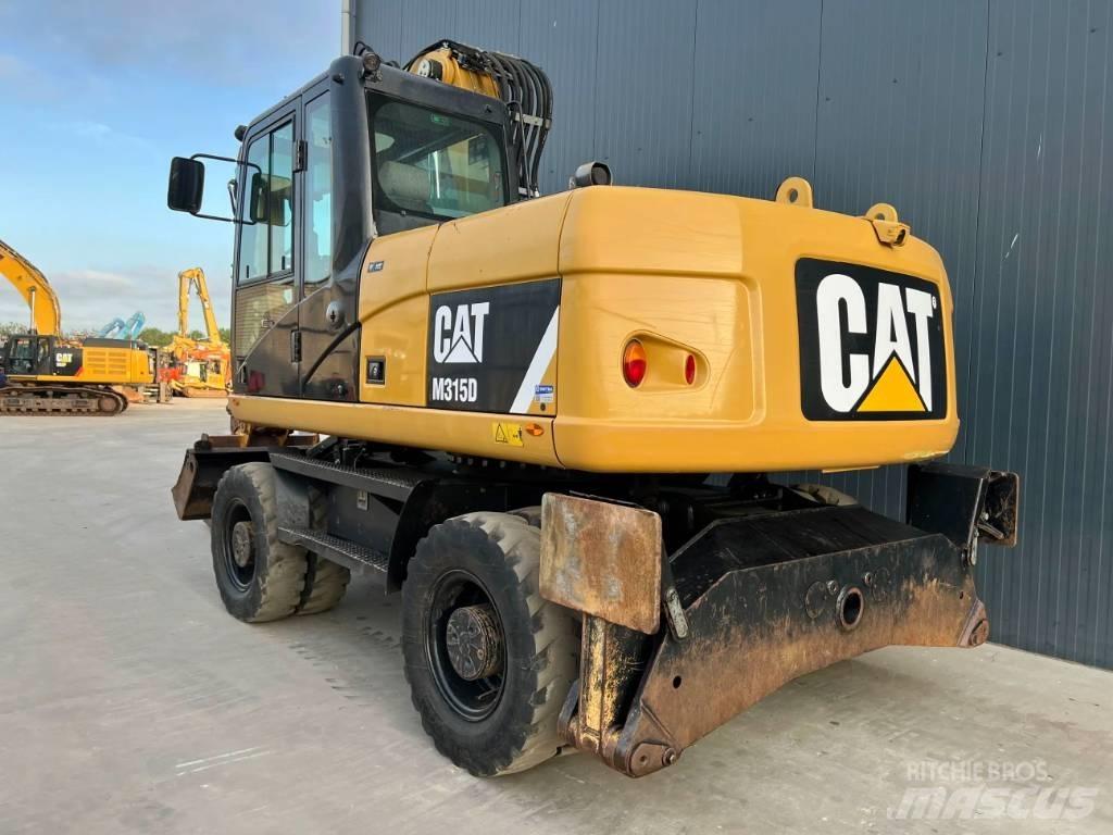 CAT M315D Gumikerekes kotrók