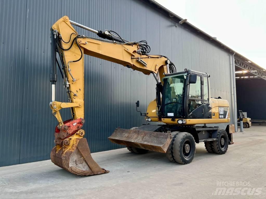 CAT M315D Gumikerekes kotrók
